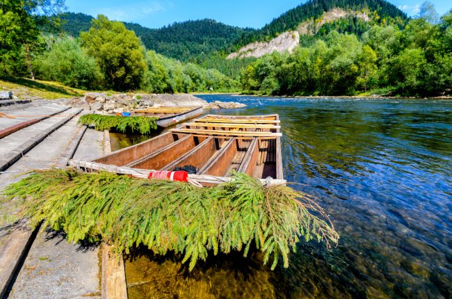 Wooden rafting boats on shore of Dunajec river, Pieniny Mountains, Poland